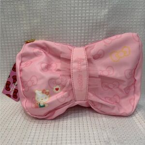 Hello Kitty Pink Bow shaped pouch. Hello Kitty and heart on front